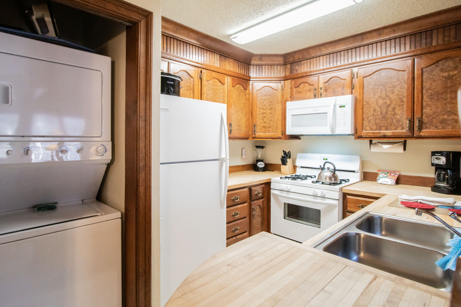 A spacious kitchen and washing machine in the units at VRI's Sunburst Resort in Steamboat Springs, CO.